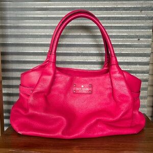 Bright pink Kate Spade leather bag.